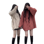 Twist knit loose mid length pullover sweater for women