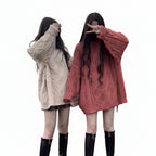 Modern loose style twist knit mid length sweater for women